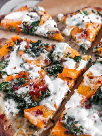 finished recipe of butternut squash pizza with kale and pancetta