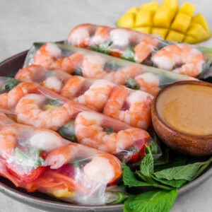 fresh spring rolls with shrimp, vegetables, mango and homemade peanut sauce