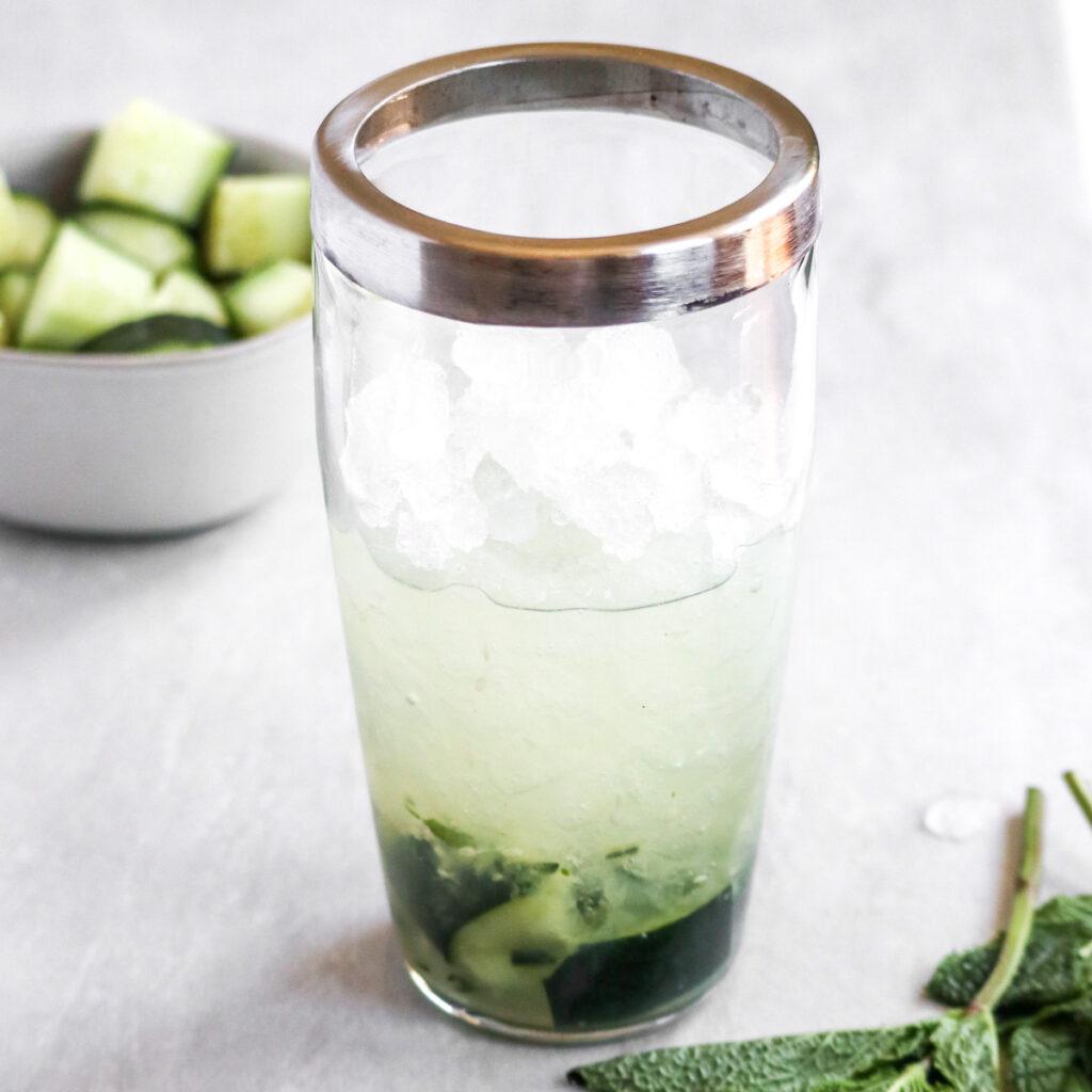 step 3: add vodka, lime, and ice and shake vigorously